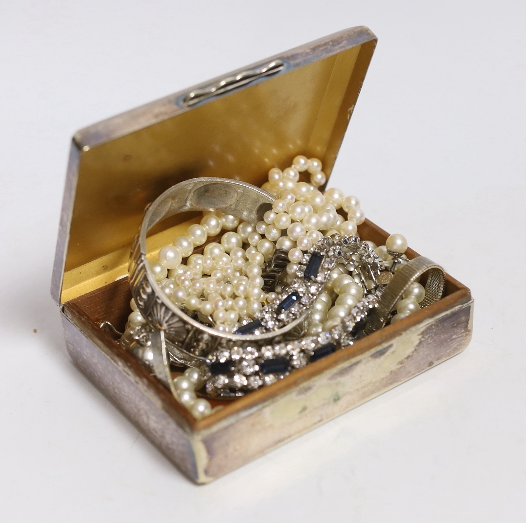 A double strand graduated cultured pearl necklace, with paste set white metal clasp, 44cm, a pair of 9ct and cultured pearl ear clips and a small quantity of assorted costume jewellery including two colour paste set brac